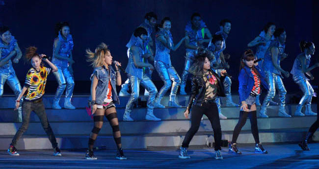 5 of 10<br />Various singers and dancers performed in front of the Big-O during the Expo 2012 opening ceremony on May 11, including one of South Koreas most well known girl groups, 2NE1.