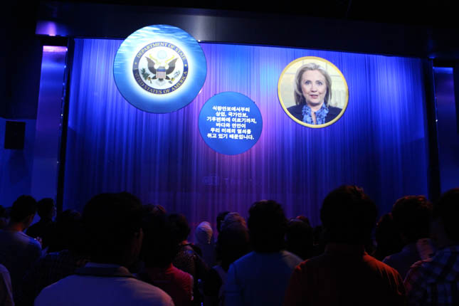 The first of two presentations inside the USA Pavilion is projected onto a water screen. When the presentation ends, the water stops flowing and visitors pass through into the next theater area.