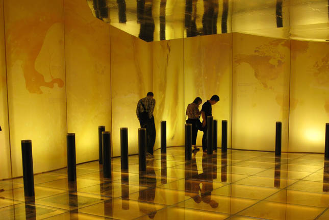 In the Lithuania Pavilion, the walls, floor, and ceiling glow in amber tones to highlight the mineral that is the focus of that countrys effort.